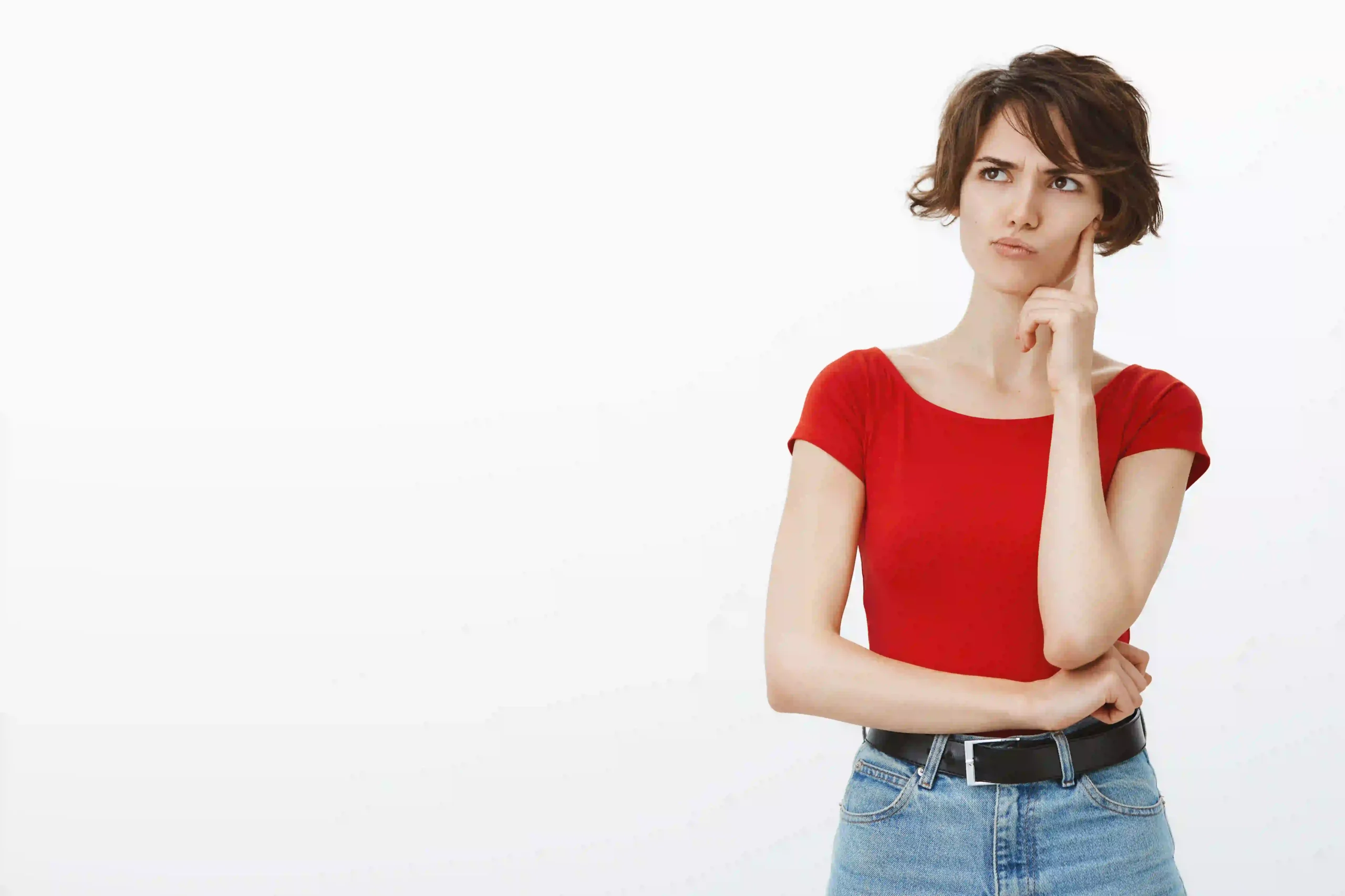 Person thinking about how to review sample images before hiring a photo editing provider.